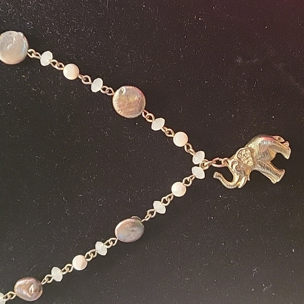 Extra long LOFT mother of pearl beaded necklace with elephant pendant.
